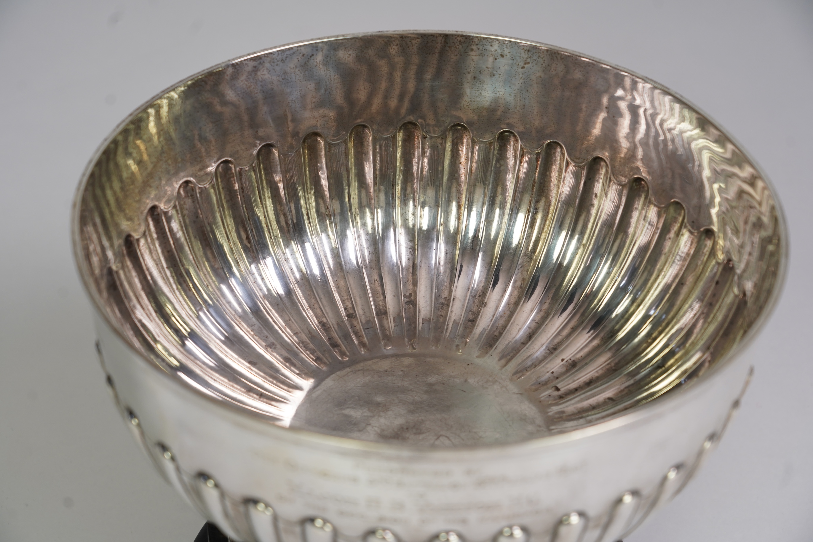 A late Victorian demi-fluted silver presentation punch bowl, by Sibray, Hall & Co